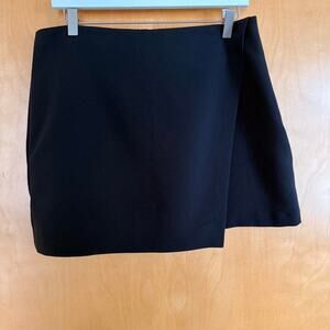 Black mini skirt has fold